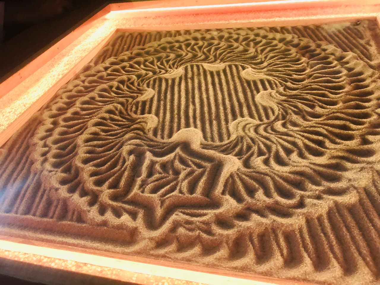 Macro perspective of carved sand texture and ball trajectory