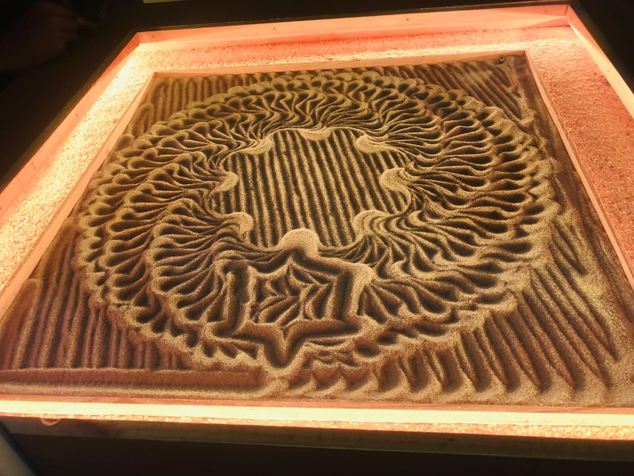 Harmonic wave geometry pattern in warm amber illumination